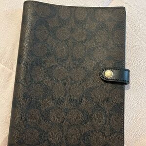 Black and Brown Monogram Coach Book
